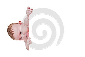 Sly baby in a crib with a angry look, isolated on a white background. Fu