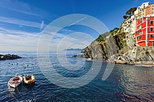 Smal boats at lagoon of Riomaggiore town in Cinque Terre Nationl park, Italy