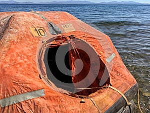 A smal life raft floating on the sea