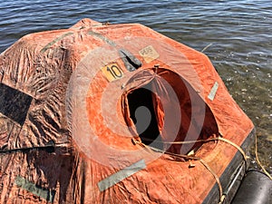 A smal life raft floating on the sea