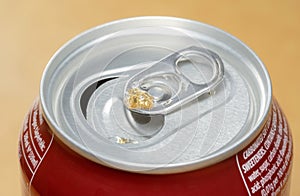 Small 330 ml open metal can of soda, macro top part extreme closeup, object detail. Carbonated sugary drinks consumption, beverage