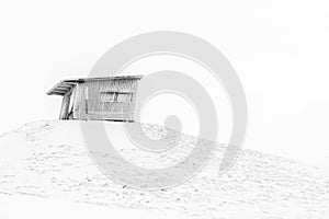 Small abandoned barn on the hill. Finland, Ruka. Black and white image