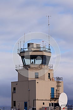 Small air traffic control tower man behind glass