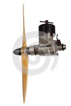 Small aircraft model diesel engine with propeller, isolated against white background