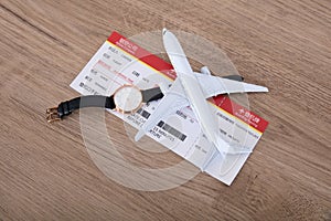 Small aircraft model and plane ticket and watche
