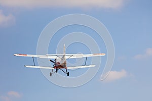 Small airplane against blue sky