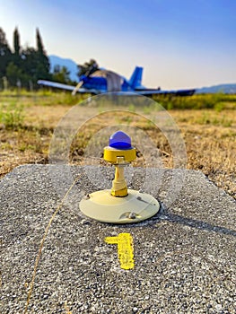 Small airplane and airport lamp