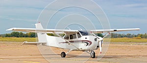 Small airplane in dirt airfield