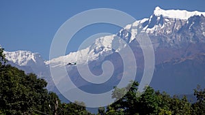 Small Airplane Flying Over Himalayan Mountain Range