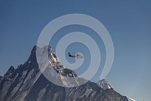 Small Airplane Flying Over Himalayan Mountain Range