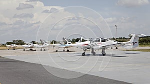 Small airplane in front of hangars