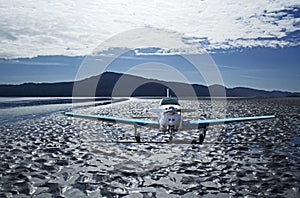 Small Airplane on Heavily Textured Beach