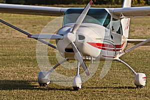 Small airplane with a propeller on the grass