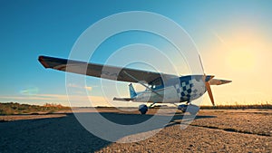 A small airplane on a runway, close up.