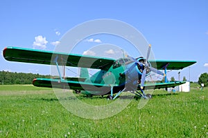 A small airplane is at the small aerodrome.