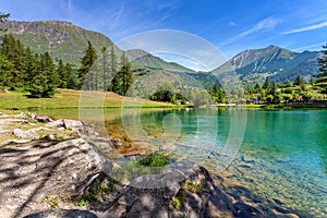 Small alpine lake among mountains.