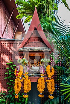 Small altar flower offerings Jim Thompson house Bangkok Thailand