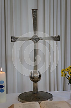 Small altar with holy cross and open bible