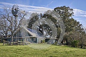 A small American steading with its associated Aermotor water pumping Windmill in Brazos Bend State Park, Texas.