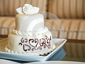 Small anniversary complimentary white chocolate cake in luxury hotel