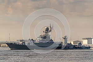 Small anti-submarine ship runs along Kronstadt during the celebration of the Day of The Navy. 28 July 2019. photo