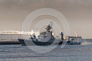 Small anti-submarine ship runs along Kronstadt during the celebration of the Day of The Navy. 28 July 2019. photo