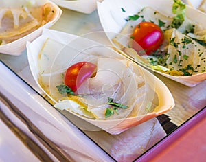 Small appetizers with swordfish and cherry tomatoes