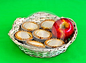 Small apple pies in a basket.