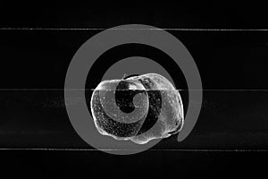 Small apple in see trough water