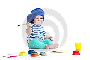 Small artist baby with paints