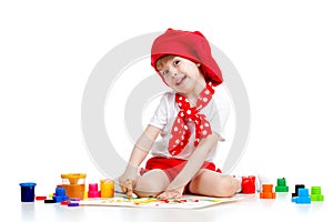 Small artist child painting with finger