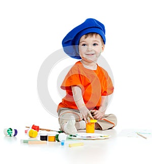Small artist child with paints