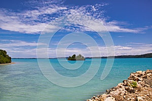 Small atoll in a turquoise lagoon in maratua island