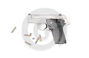 Small automatic gun .22 with bullet isolated