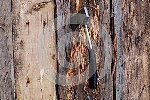 Axe on a wooden board photo