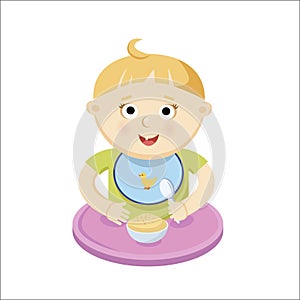 Small baby eating porrige