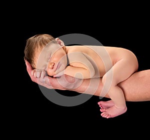 Small baby on fathers hand