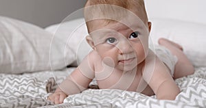 Small baby girl on a bed