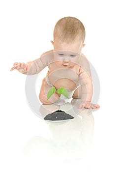 Small baby with green plant isolated