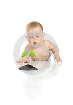 Small baby with green plant isolated