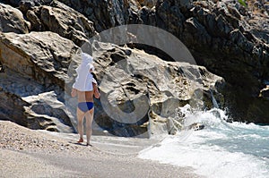 Small baby in poncho sits on Dad`s neck. Happy Father`s day background with copy space. Family vacation concept. Caucasian man