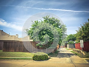 Small back alley at suburban neighborhood in North Dallas, Texa