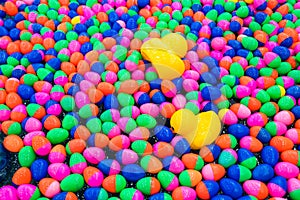 Small ball and yellow rubber duck in the water for playing games.