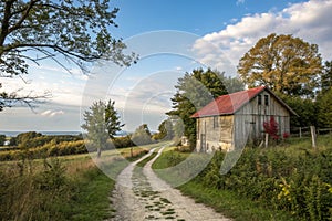 Small barnhouse on plot with trees and path