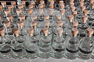 Small batch gin production distillate bottles photo