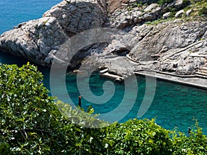 Small bay with crystal clear water surrounded by rocks