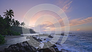 A small beach on a tropical island. Sunrise over the ocean in Sri Lanka. Tropical Island