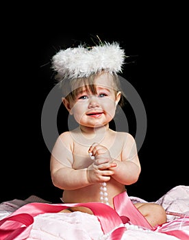 Small beautiful baby girl in a angel fansy dress