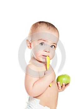 Small beautiful baby girl with green apple