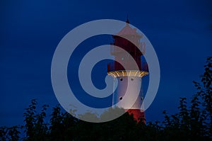 A small and beautiful lighthouse at night and bright light in FalshÃÂ¶ft, Germany